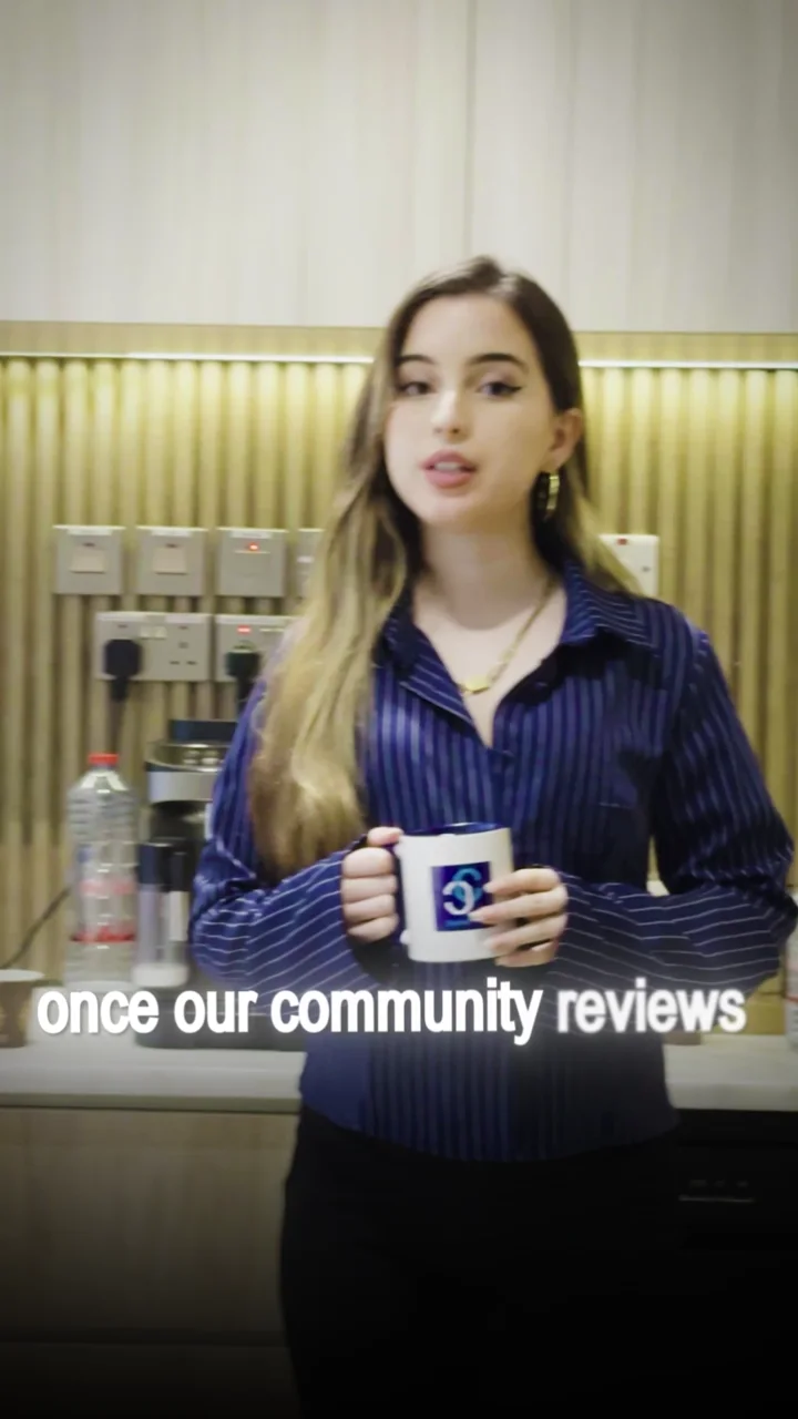 A Capital Chain presenter holding a branded mug