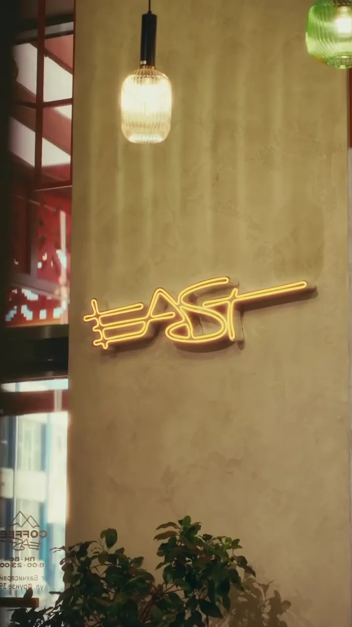 The illuminated East sign inside the café